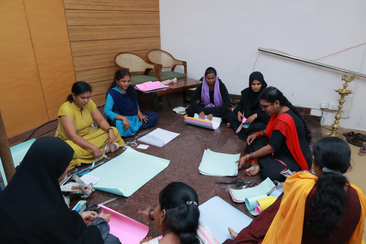 A woman sewing with a sewing machine.